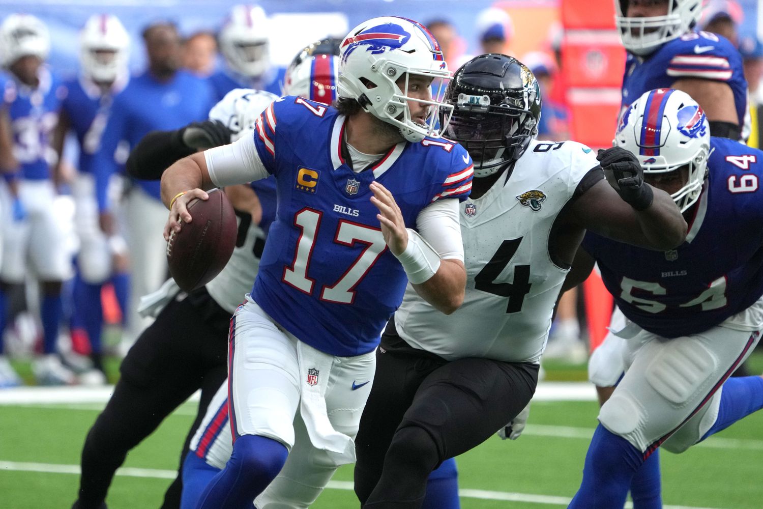 Bills quarterback Josh Allen feels the Jaguars pressure during Sunday's game.